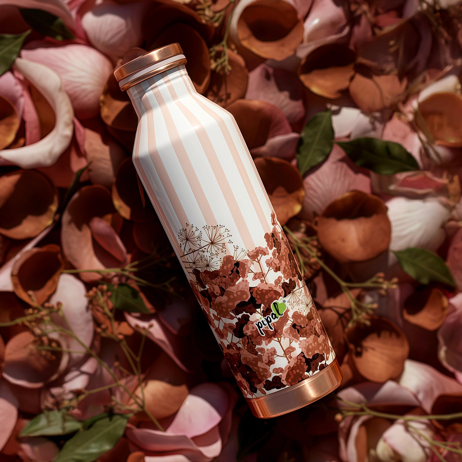 Decorative copper water bottle with floral design on a floral background