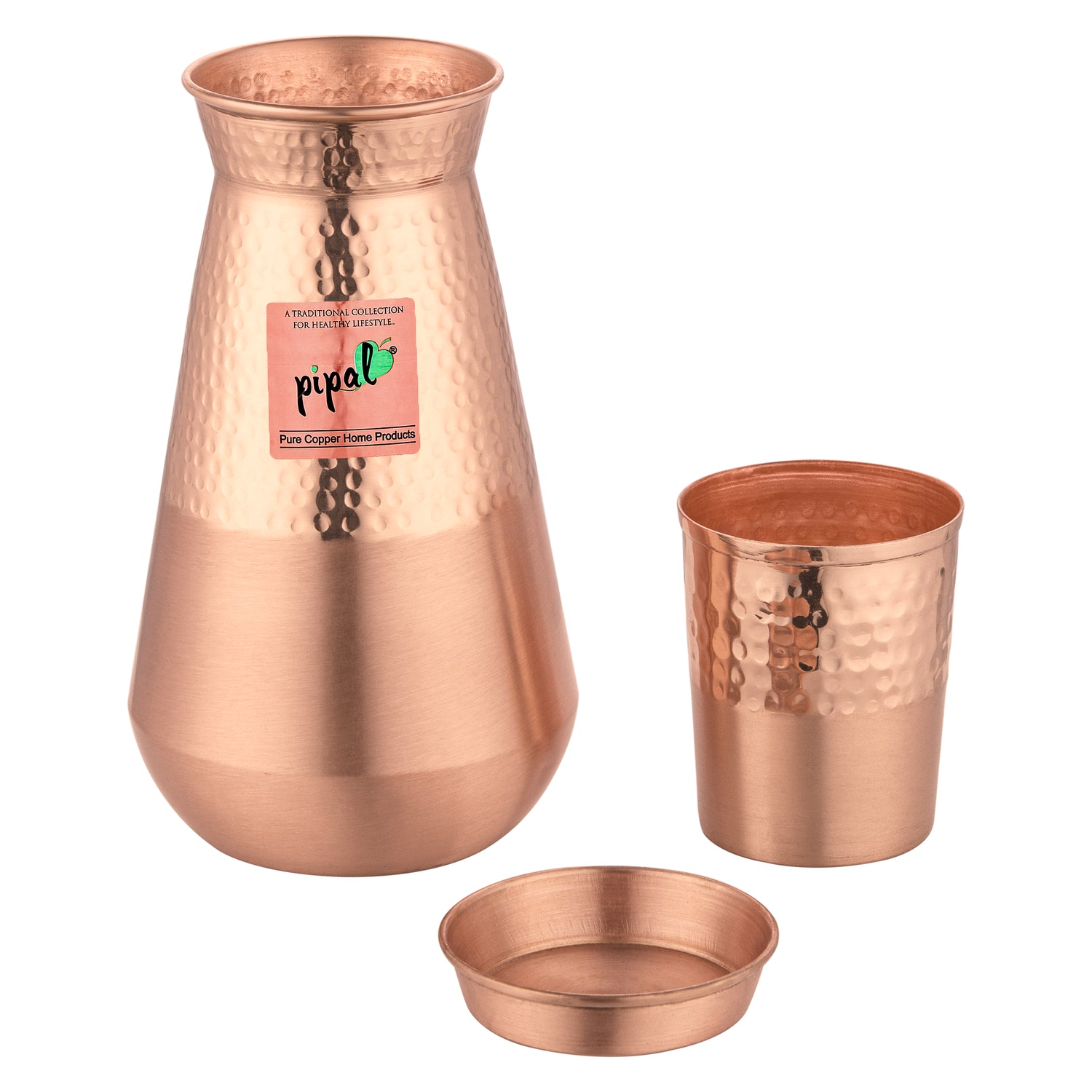 Detail of dual-tone hammered and matte copper pithcer set with separate lid component